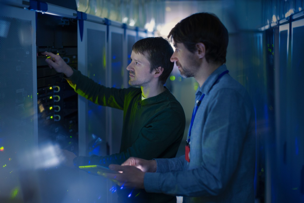 Server room technicians working on panel