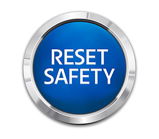Reset safety button with text on button