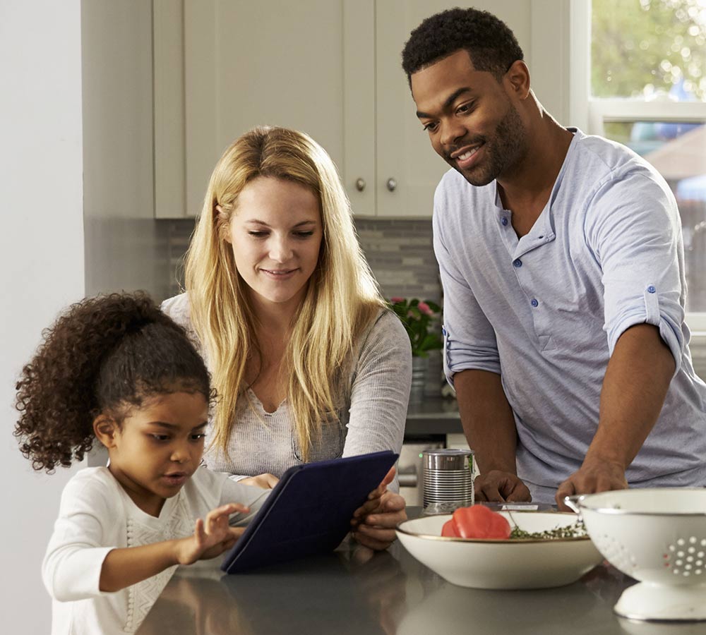 family-playing-on-tablet-in-kitchen.jpg
