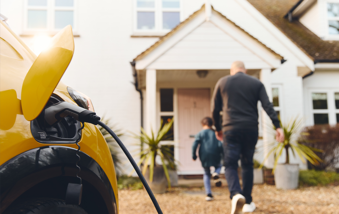 ev-car-foreground-dad-son-entering-home-getty-1473857496.png