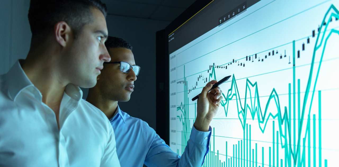 businessmen-studying-graphs-on-an-interactive-screen-in-business-meeting-image188865852