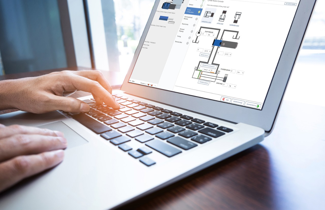 Young businessman multitasking using laptop.Business technology lifestyle.strategy planning.research information concept.working in modern workplaces.