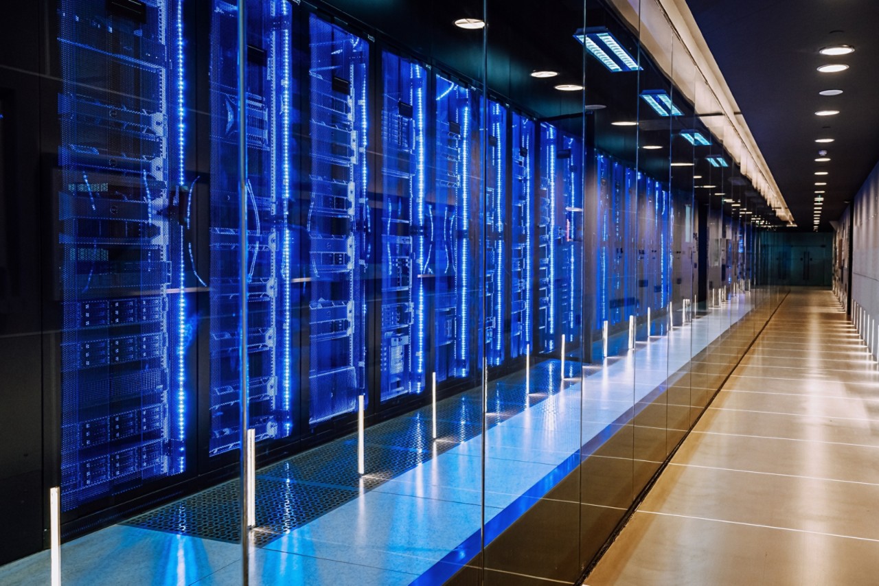 diminishing-perspective-view-of-a-row-of-blue-lit-computer-servers-getty-1447484950