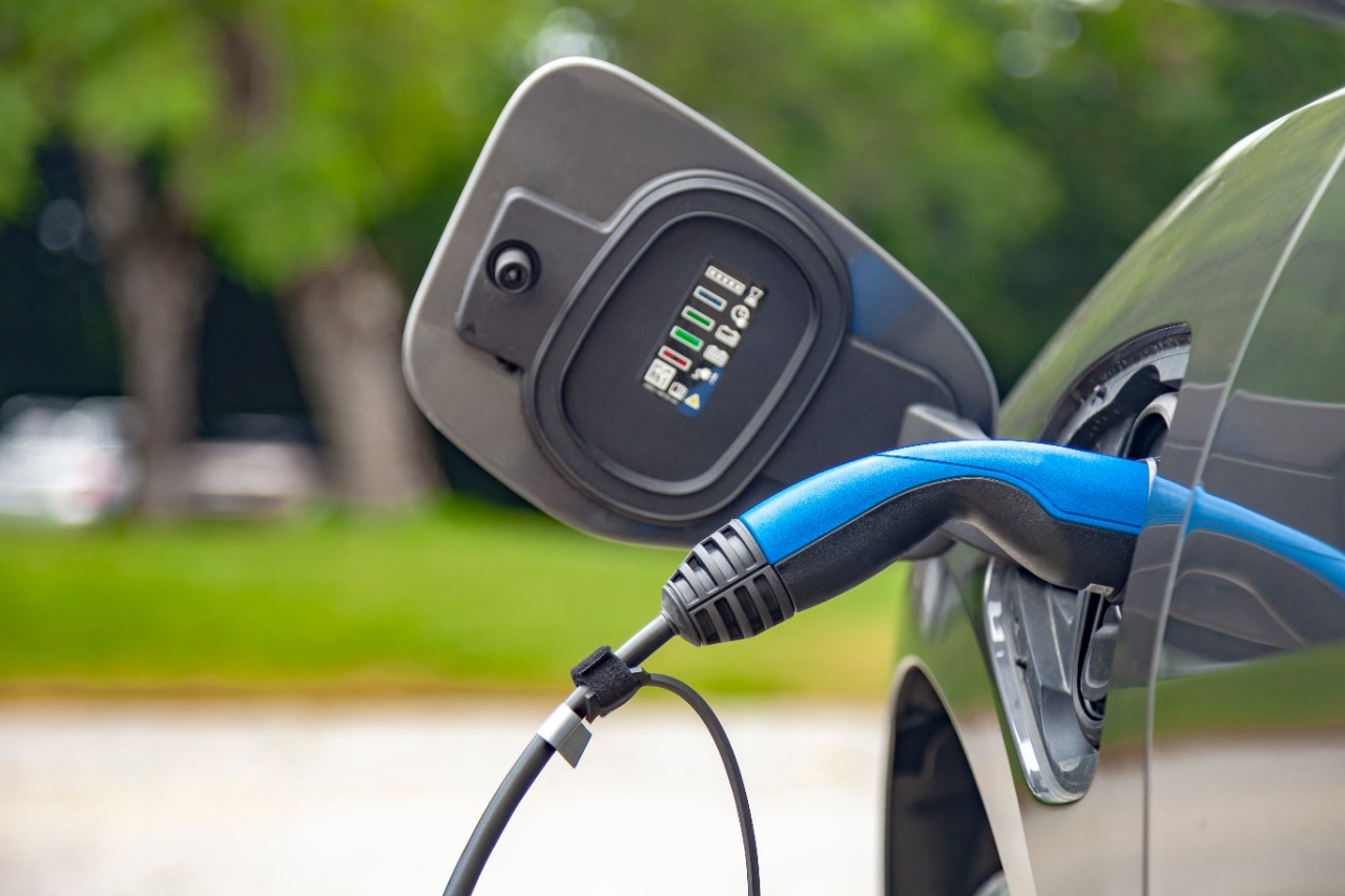 electric-vehicle-charging-blue-plug-getty-1163358533