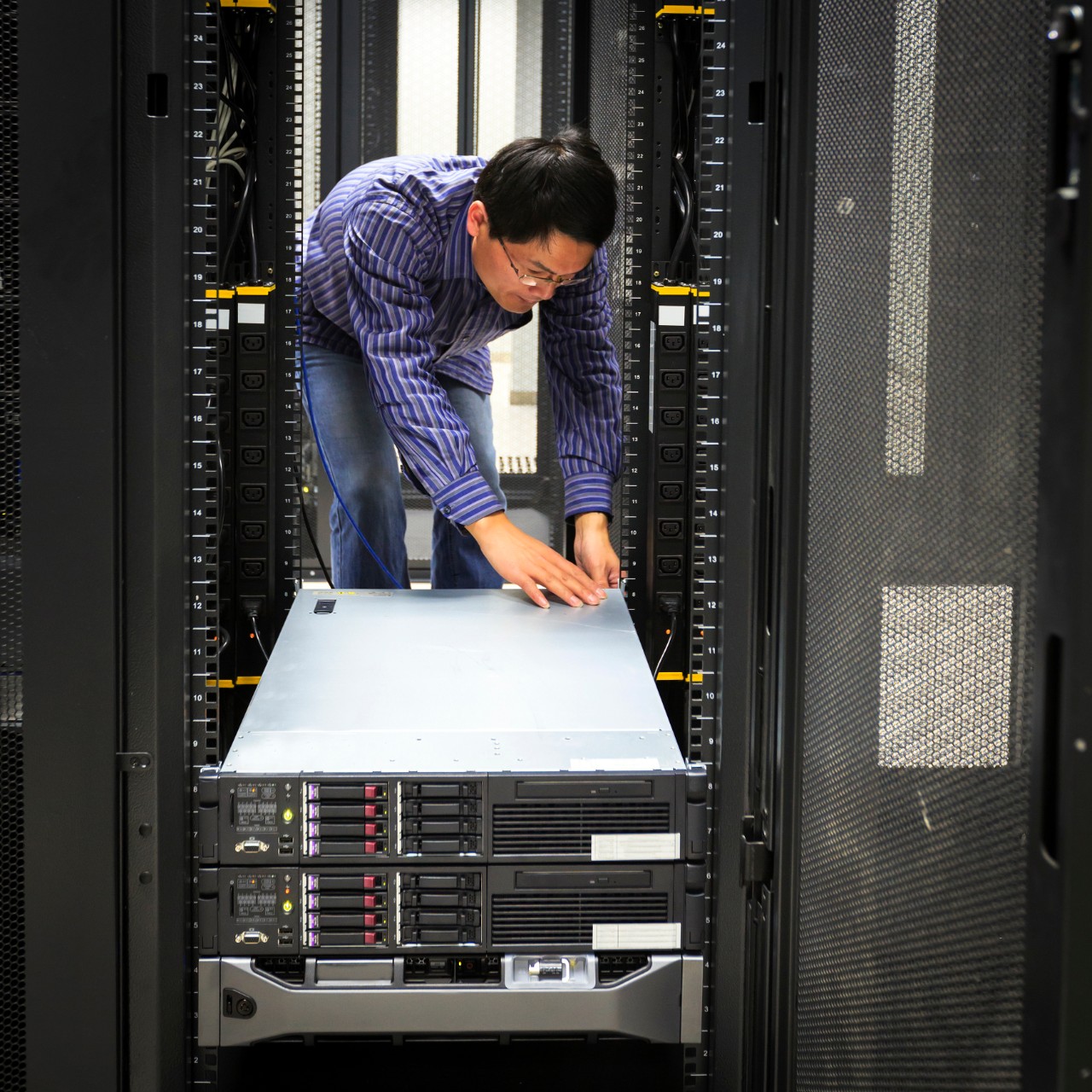 Computer Technician/network administrator working on a server