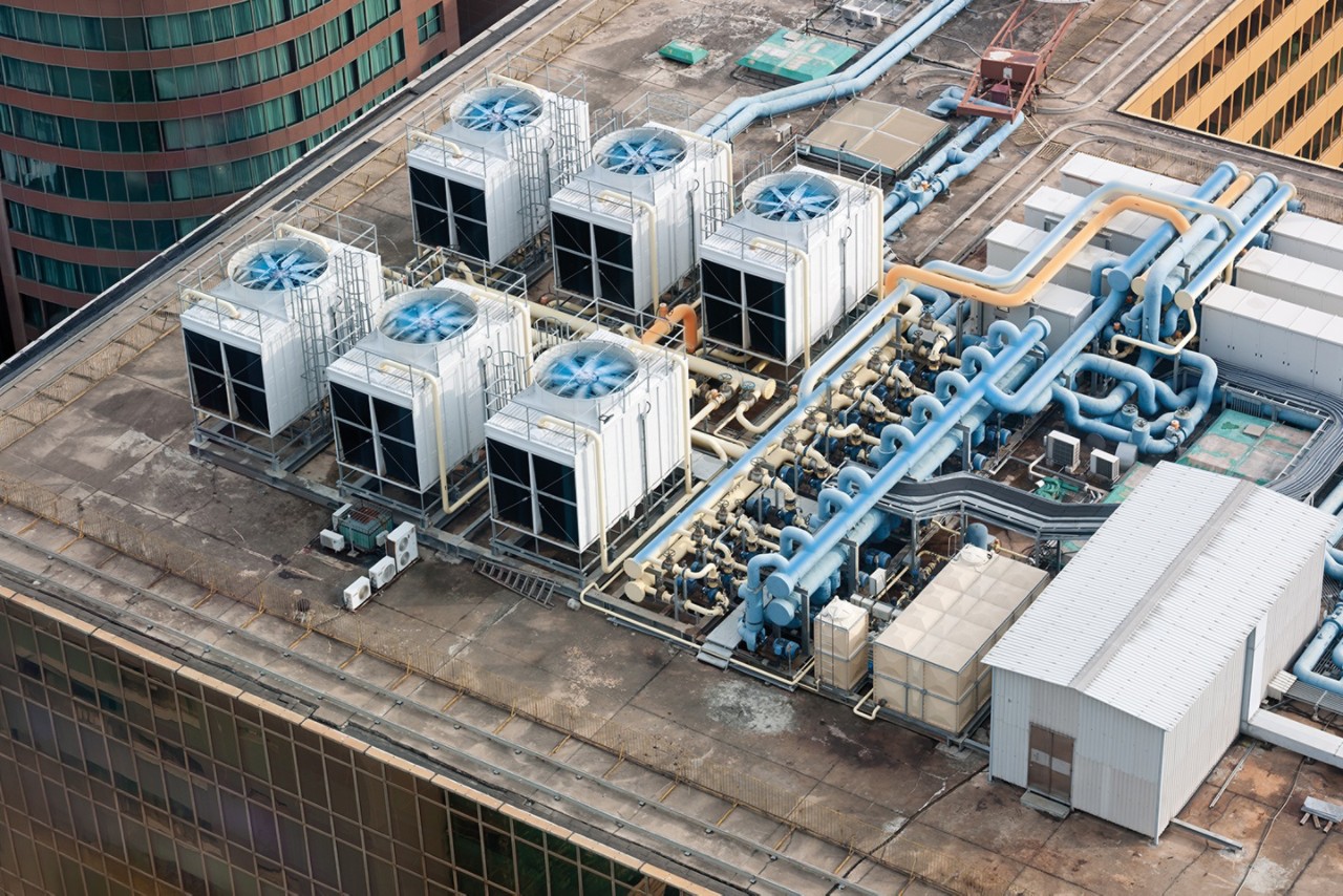 Engineers on roof repairing hvac getty 492893234