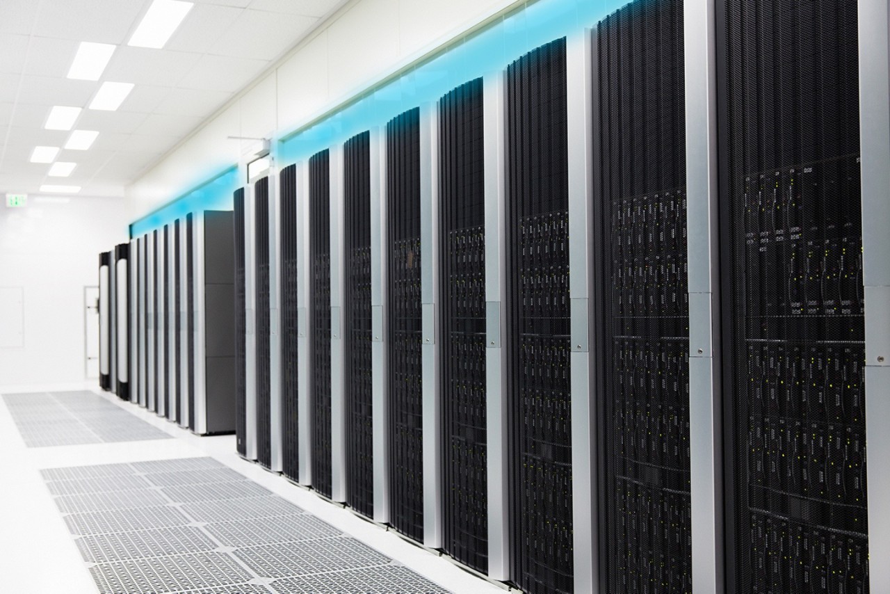 Engineer with Tablet in Server Room