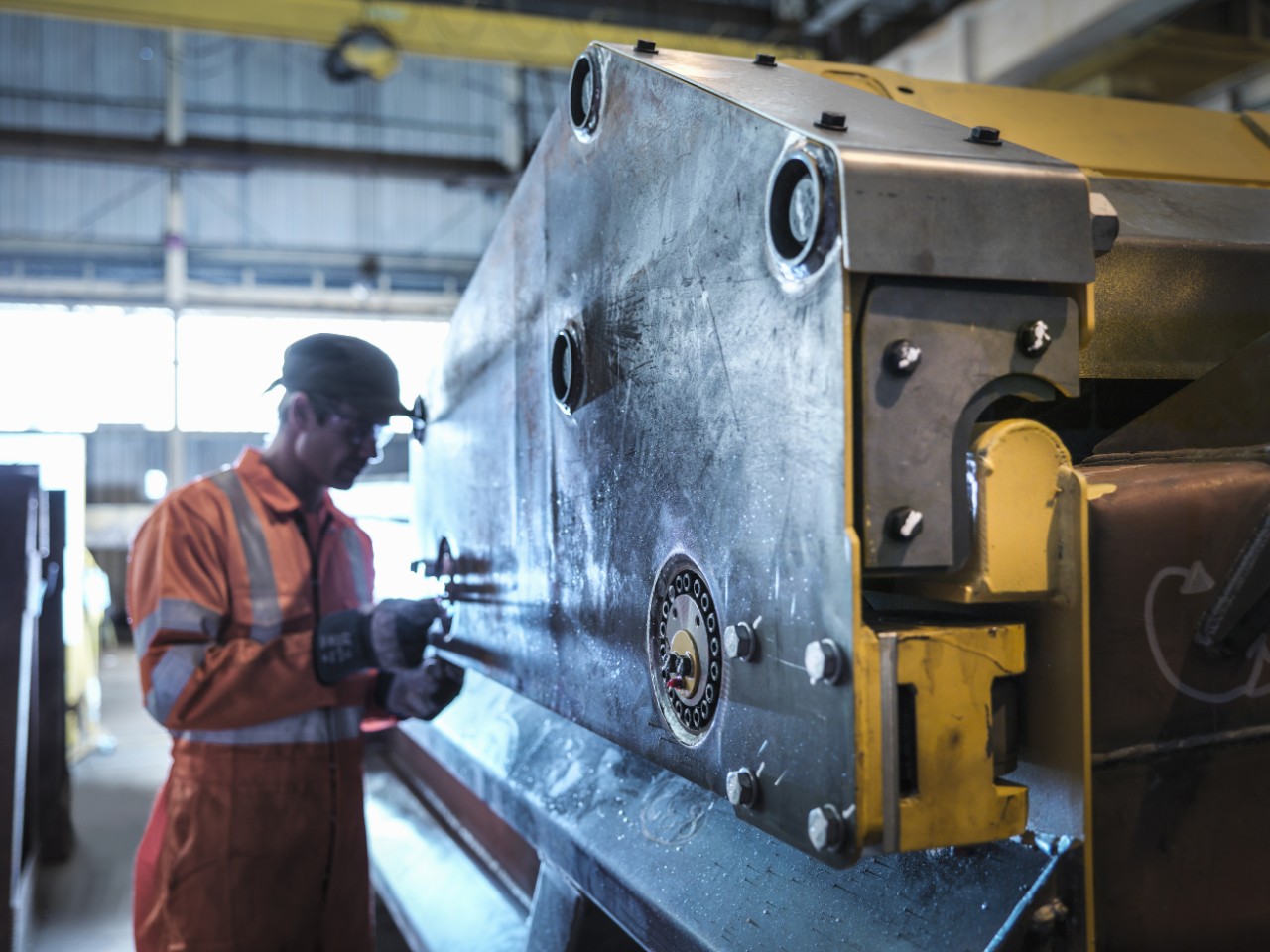 Engineer inspecting work in factory