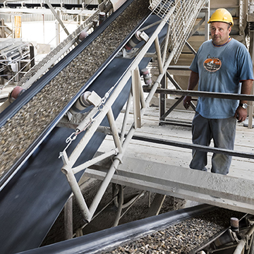 Person with helmet gravel conveyor belts