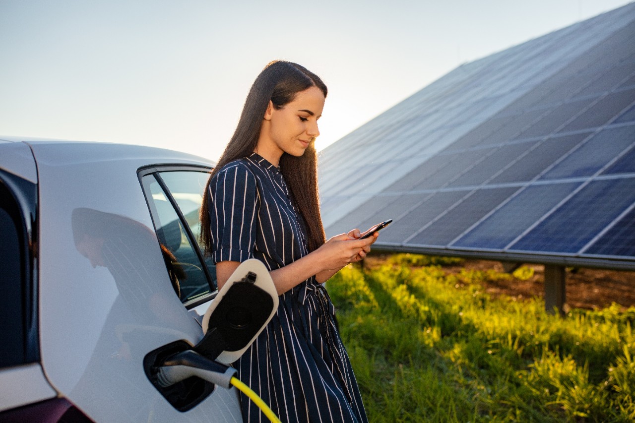woman-waiting-for-ev-charging-getty-1284782429