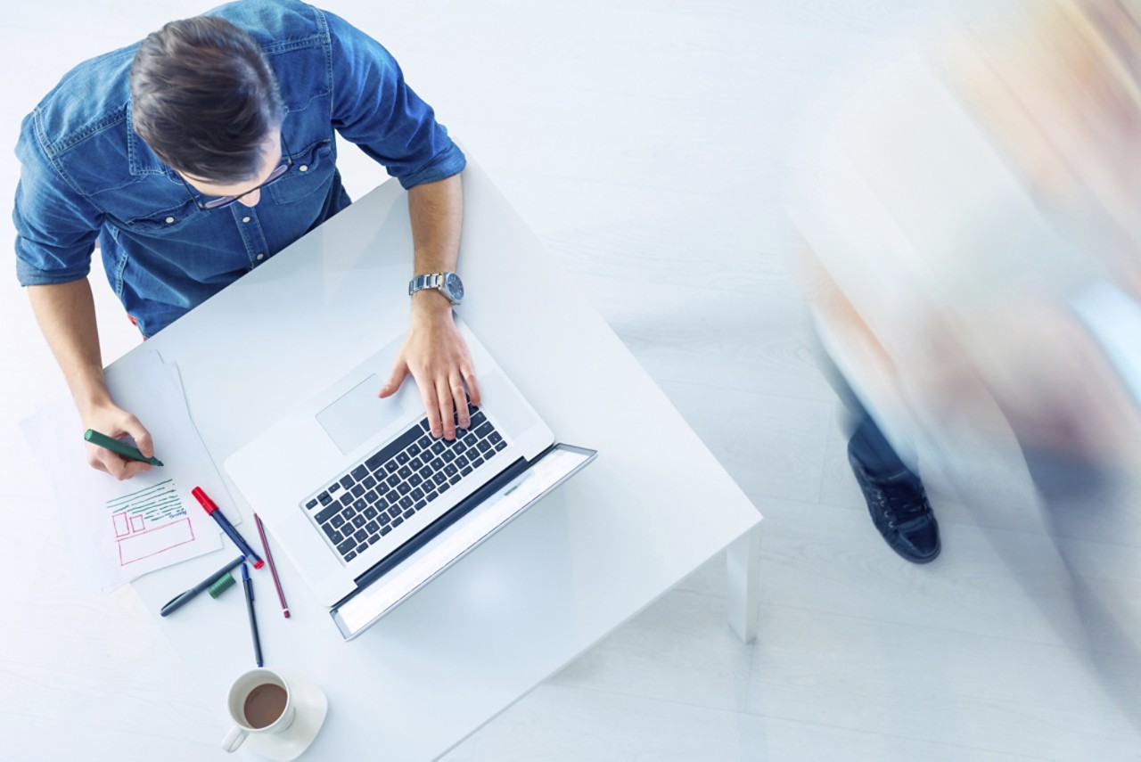 casual guy working on laptop computer programmer getty 470453903