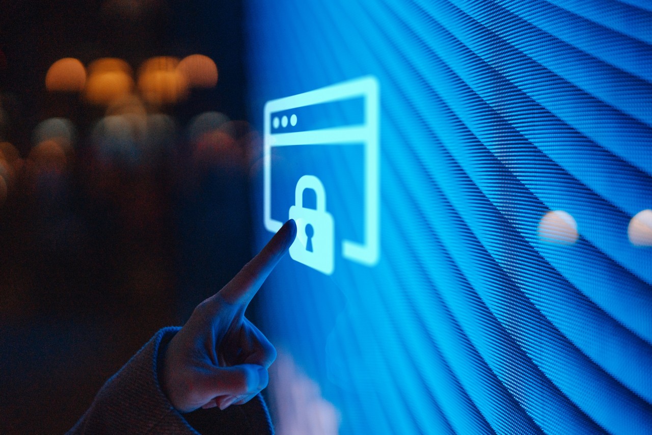 close-up-of-female-hand-touching-illuminated-digital-screen-displaying-a-locked-sign-getty-1437761046