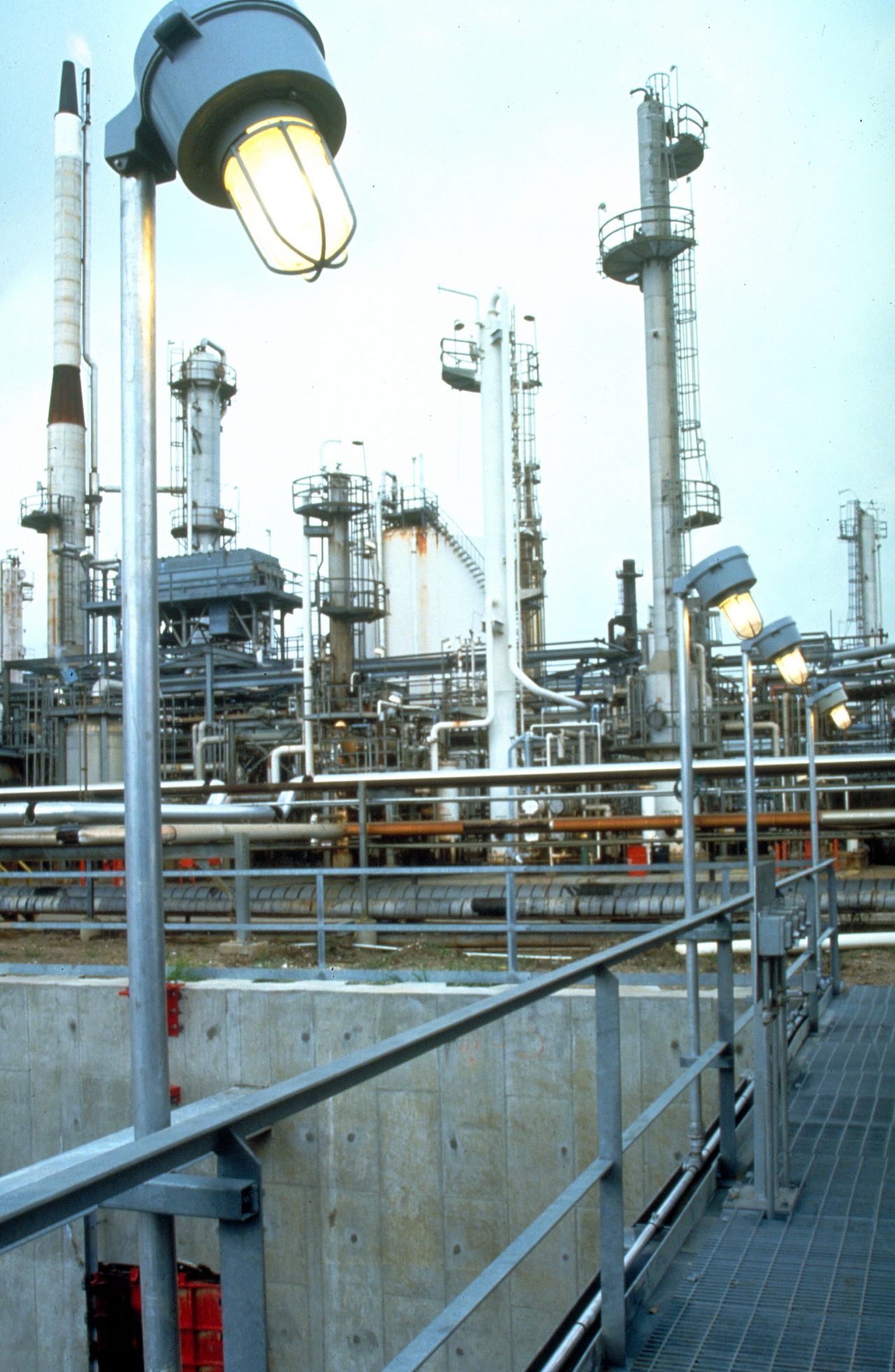 Champ led light in oil gas refinery walkway